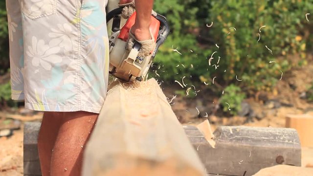 Saw sawing wood for home