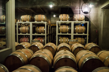Hokkaido, Japan- 9 NOV 2015: Wooden barrels use to store Japanese wine produced in wineries on Furano, Hokkaido. Furano Winery is open to the public and includes free wine tasting. 