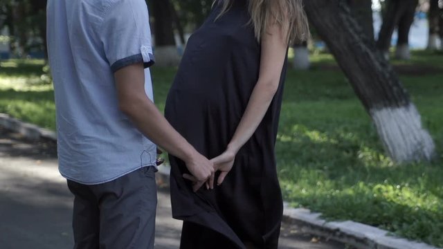A loving couple holding hands in the park