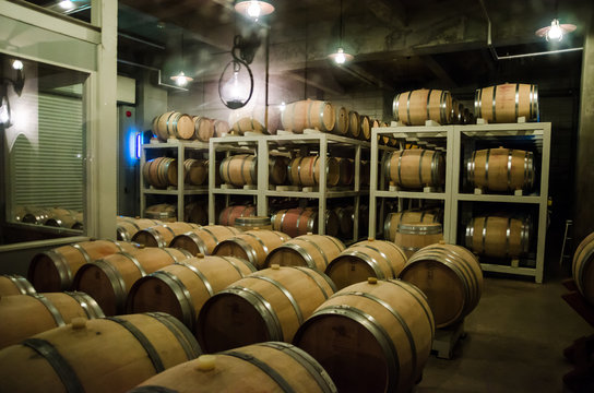 Hokkaido, Japan- 9 NOV 2015: Wooden barrels use to store Japanese wine produced in wineries on Furano, Hokkaido. Furano Winery is open to the public and includes free wine tasting. 