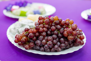 delicious  fruit , grapes, dragon fruit , melon  on the white bowl , healthy food for everybody with copy space