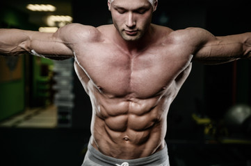 Obraz na płótnie Canvas young man train in gym healthcare lifestyle sexy caucasian man