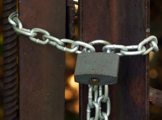 Padlock on the chain, locking the entrance. Protection of information and computers.