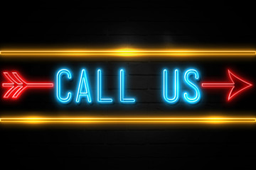 Call Us  - fluorescent Neon Sign on brickwall Front view
