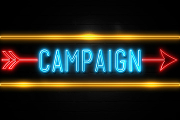 Obraz premium Campaign - fluorescent Neon Sign on brickwall Front view