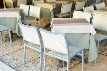Light tables and chairs in the restaurant before opening. An empty restaurant.