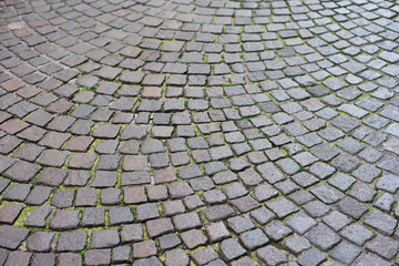 Fototapeta premium Mosaic dark pavers of small stones