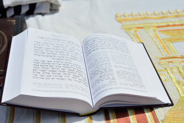 Fototapeta premium JERUSALEM, ISRAEL - APRIL 2017: Talmud Tora Tanach Books lying on table during prayer in Bar Mitzwa Ceremony at the Western Wall Jerusalem (Kotel)