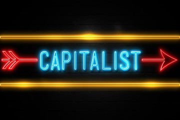 Capitalist  - fluorescent Neon Sign on brickwall Front view