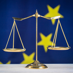 Law and Justice symbols. EU flag background.