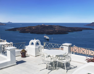 Greece, Santorini Island, terrace cafe on the background of the Aegean Sea