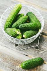 Fresh green cucumbers in a beautiful basket