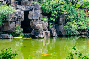 Fototapeta na wymiar Cave entrance in lake