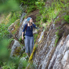 Free traveler girl in mountains mountaineering Travel Lifestyle concept landscape on background vacations adventure journey outdoor, human and nature.