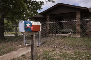 Fotobehang Mailbox painted with the Texas Flag in fron of a house in Texas, USA  Concept for travel in Texas © Tiago Fernandez