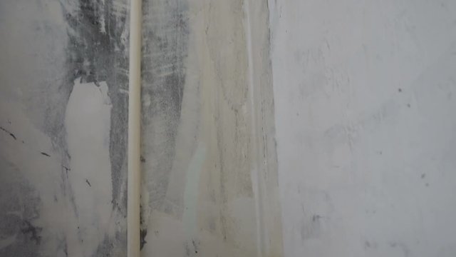 Wallpaper paste in bucket on the floor. Mixing wallpaper glue in