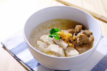 white pork sausage with noodle in soup, asian style