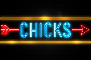 Chicks  - fluorescent Neon Sign on brickwall Front view