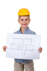 Little cheerful builder in yellow hardhat with paper plan in hands, isolated on white