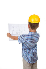 Young serious builder reading a construction plan, turned back, isolated on white