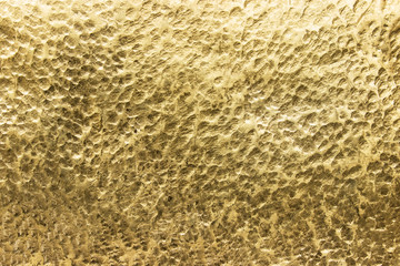 sheet of yellow metal,  texture gold or bronze