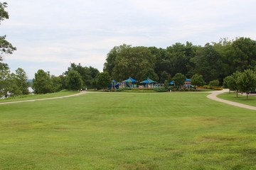 Obraz premium The park playground area on the other side of the field.