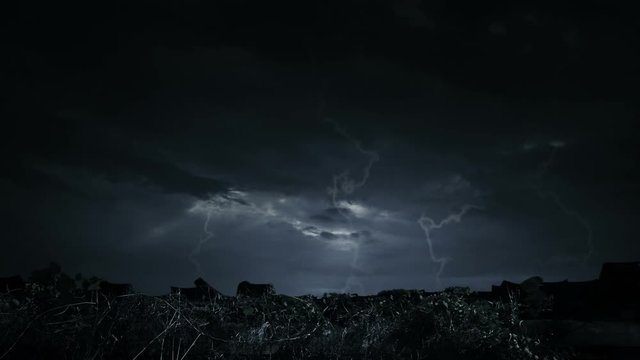 Human skull on ancient window castle with dead tree over moon and cloudy sky, Spooky background, Halloween concept