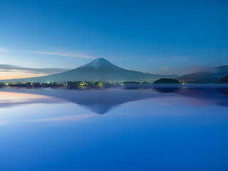 Fototapeta na wymiar night view and reflection on water from mountain fuji at kawaguchiko lake japan