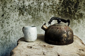  photography still life old  kettle placed on a wooden floor.