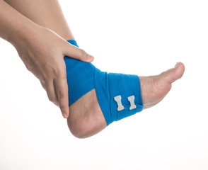 Ankle wrapped in elastic bandage on white background,Ankle pain