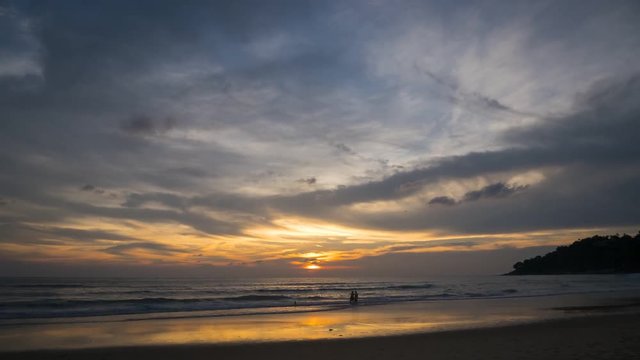 Time - lapse Activities on the beach with colorful sunset  at sunset time , Phuket Thailand.