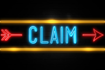 Claim  - fluorescent Neon Sign on brickwall Front view