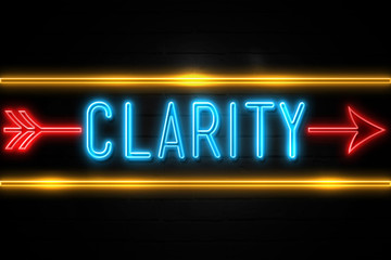 Clarity  - fluorescent Neon Sign on brickwall Front view