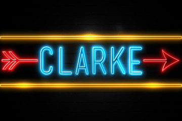 Obraz premium Clarke - fluorescent Neon Sign on brickwall Front view