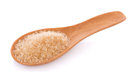 Brown sugar in wooden spoon on white background