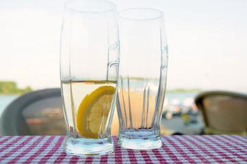 Healthy drink, a glass of water and a lemon slice