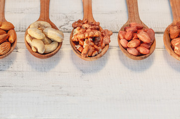 Wooden spoons with different nuts, 5 pieces