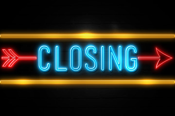 Closing  - fluorescent Neon Sign on brickwall Front view