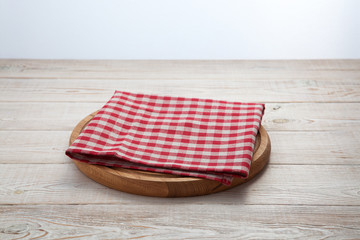Napkin. Stack of colorful dish towels on white wooden table background top view