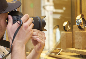 Naklejka premium The photographer takes a picture of the shop window
