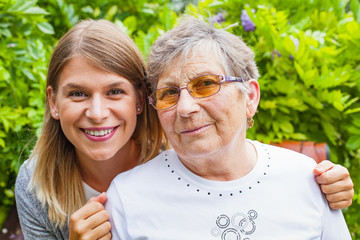 Senior lady with beautiful granddaughter