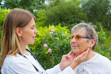 Doctor examining sore throat