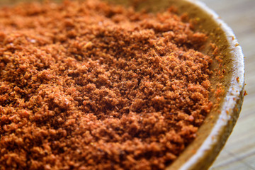 Spices in a wooden spoon hot pepper