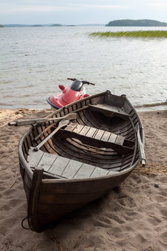 Wooden boat and hydrocycle.