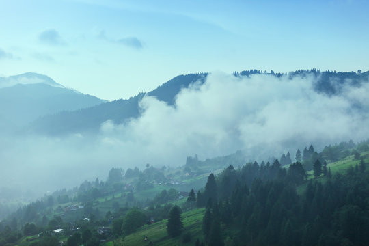 Majestic view on beautiful fog mountains in mist landscape. Dramatic unusual scene. Travel background. Exploring beauty world. Carpathian mountains. Ukraine. Europe. © beerlogoff