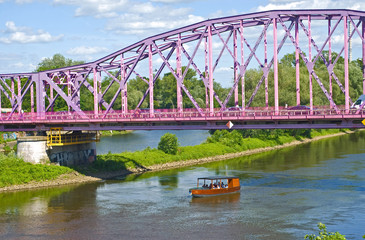 Steel pink bridge over Oder river in Glogow, Poland