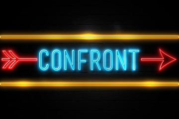 Obraz premium Confront - fluorescent Neon Sign on brickwall Front view