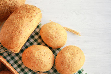 Delicious bread on wooden table