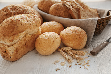 Beautiful composition with delicious bread on wooden table