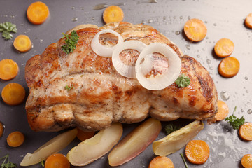 Baking tray with delicious turkey fillet and vegetables, closeup